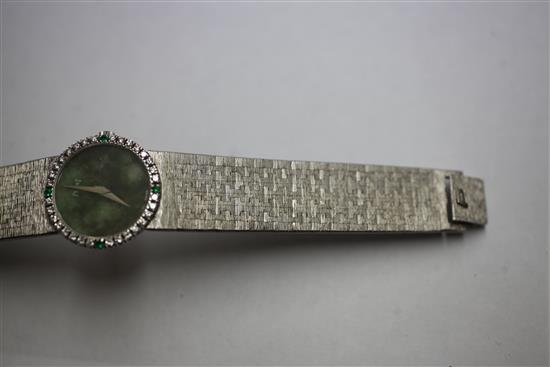 A ladys 18ct white gold Piaget manual wind wrist watch with diamond and emerald set bezel and jade dial,